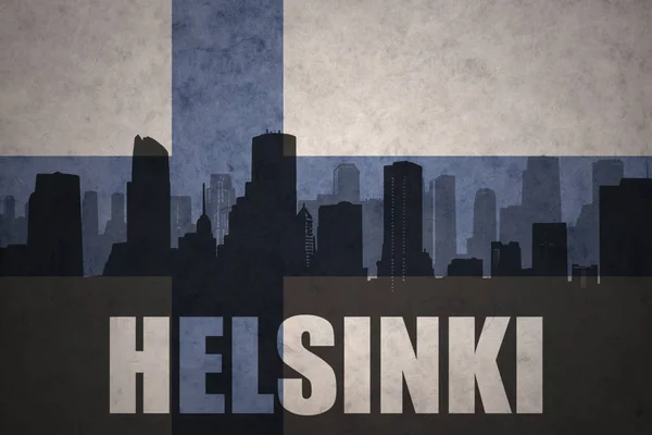 Abstract silhouette of the city with text Helsinki at the vintage finnish flag — Stock Photo, Image