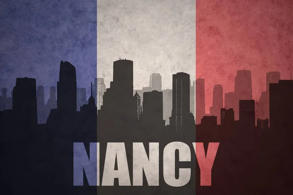 Abstracte silhouet van de stad met tekst Nancy op de vintage Franse vlag — Stockfoto