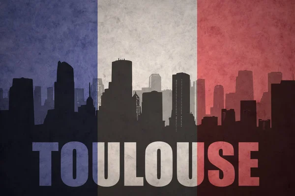 Silhouette abstraite de la ville avec texte Toulouse au drapeau français vintage — Photo