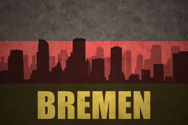 Silhueta abstrata da cidade com texto Bremen na bandeira alemã vintage — Fotografia de Stock