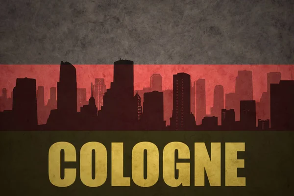 Silhueta abstrata da cidade com texto Colônia na bandeira alemã vintage — Fotografia de Stock