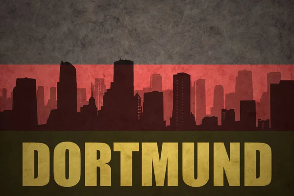 A város a vintage német zászló Dortmund szöveggel absztrakt sziluett — Stock Fotó