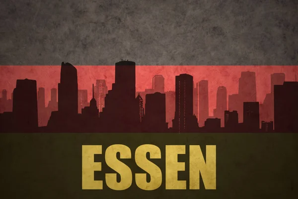 Abstrakte Silhouette der Stadt mit Text essen an der deutschen Fahne — Stockfoto