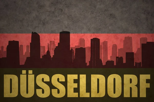 Abstrakte Silhouette der Stadt mit Düsseldorfer Schriftzug auf der deutschen Fahne — Stockfoto