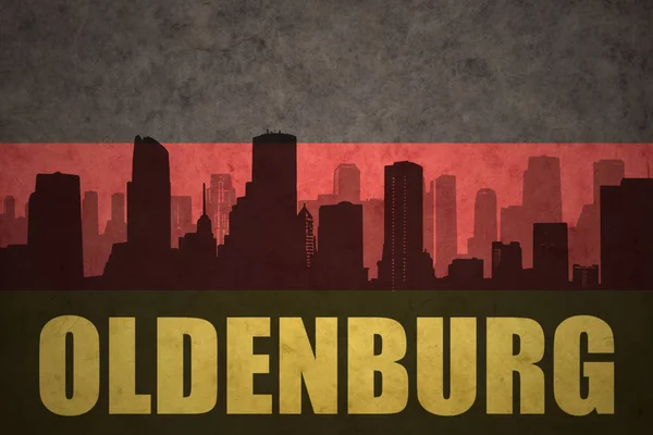 Abstract silhouette of the city with text Oldenburg at the vintage german flag — Stock Photo, Image
