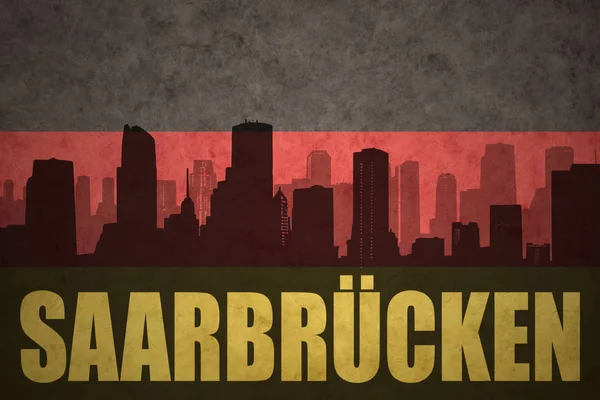 Abstrakte Silhouette der Stadt mit Text saarbrücken an der deutschen Fahne — Stockfoto