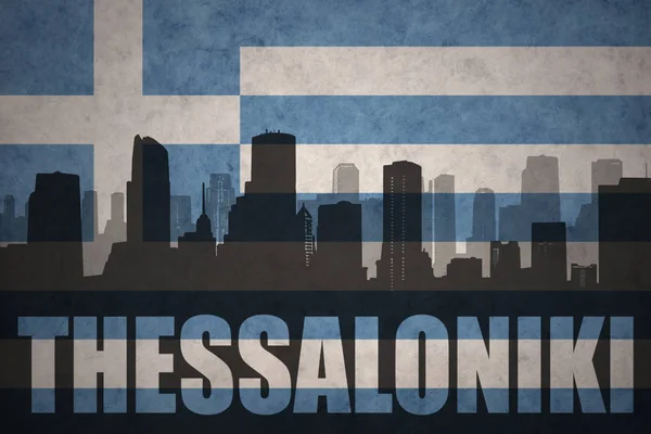 Abstract silhouette of the city with text Thessaloniki at the vintage greece flag — Stock Photo, Image