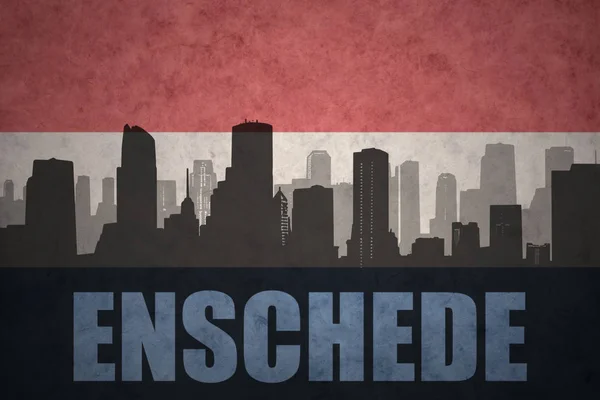 Silhouette abstraite de la ville avec texte Enschede au drapeau hollandais vintage — Photo