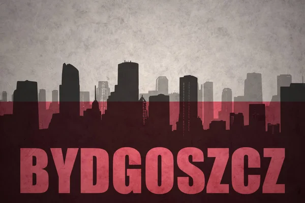 Silhouette abstraite de la ville avec le texte Bydgoszcz au drapeau polonais vintage — Photo