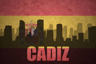 Özet metin Cadiz Vintage ile şehir silüeti İspanyolca bayrak