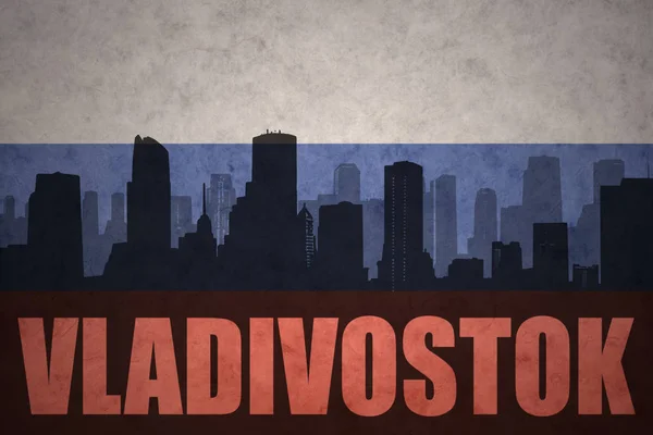 Abstrakta silhuetten av staden med text Vladivostok på vintage ryska flaggan — Stockfoto
