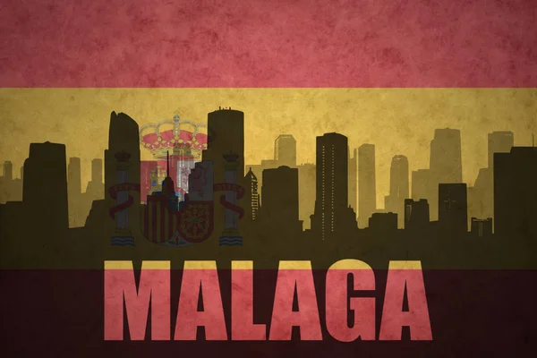 Abstrakta silhuetten av staden med text Malaga på vintage spanska flaggan — Stockfoto