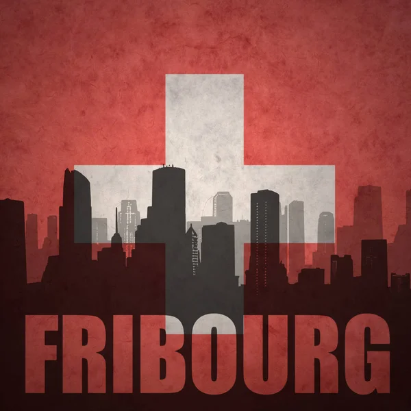 Silhueta abstrata da cidade com texto Fribourg na bandeira suíça vintage — Fotografia de Stock