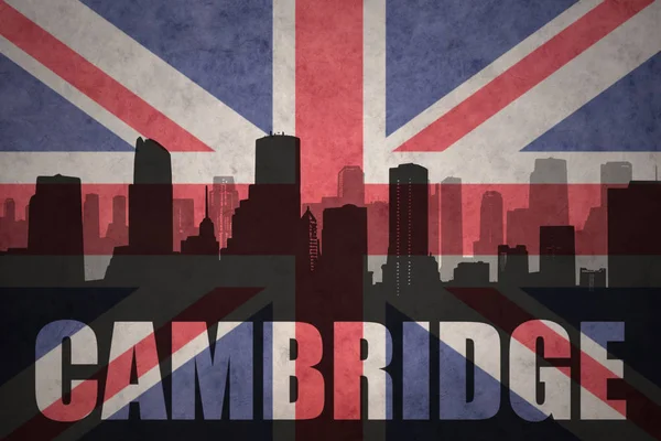 Abstracte silhouet van de stad met tekst Cambridge op de vintage Britse vlag — Stockfoto