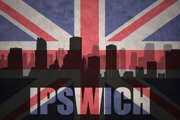 Abstract silhouette of the city with text Ipswich at the vintage british flag — Stock Photo, Image