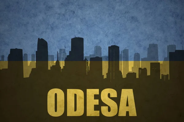 Streszczenie sylwetka miasta z tekstem Odessa na vintage flagę Ukrainy — Zdjęcie stockowe