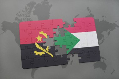 angola ve sudan bir dünya haritası üzerinde bayrağı ile bulmaca.