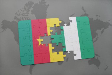 Kamerun ve Nijerya ulusal bayrak bir dünya haritası üzerinde ile bulmaca.