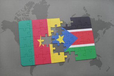 Kamerun ve bir dünya haritası üzerinde Güney sudan bayrağı ile bulmaca.