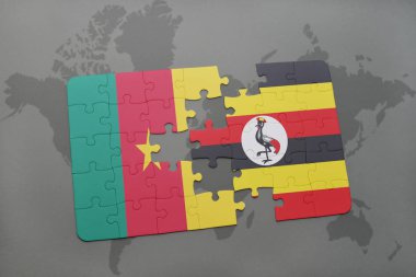 Kamerun ve uganda ulusal bayrak bir dünya haritası üzerinde ile bulmaca.