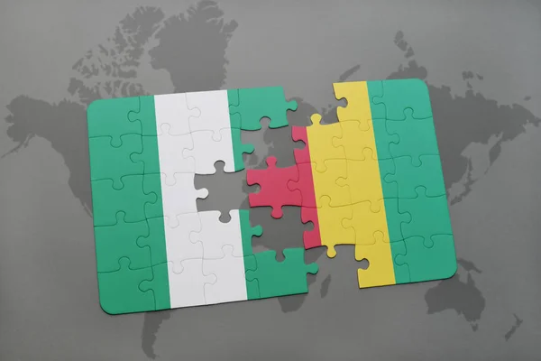 Puzzle with the national flag of nigeria and guinea on a world map — Stock Photo, Image