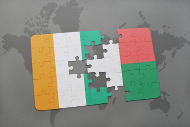 Fildişi Sahili ve Madagaskar ulusal bayrak bir dünya haritası üzerinde ile bulmaca