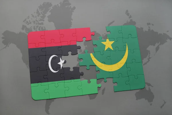 puzzle with the national flag of libya and mauritania on a world map