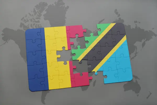 Puzzle with the national flag of chad and tanzania on a world map — Stock Photo, Image