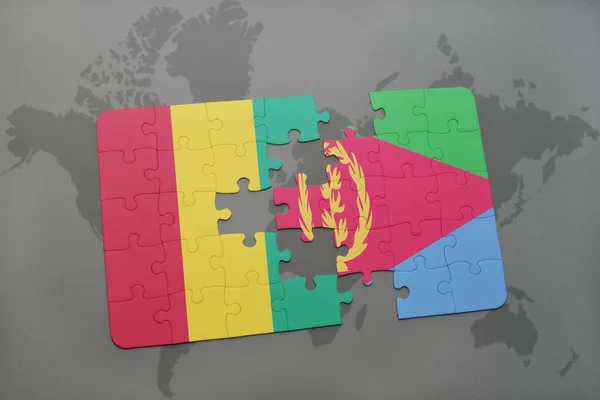 Puzzle con la bandiera nazionale di ghinea ed eritrea su una mappa del mondo — Foto Stock