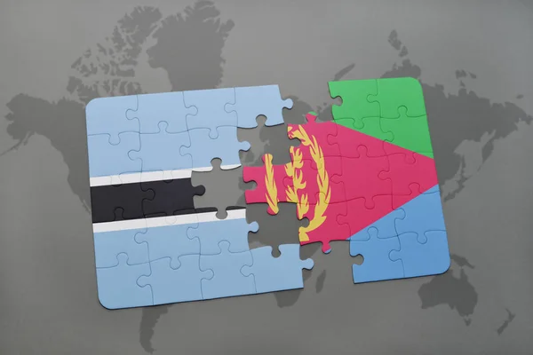 Puzzle s státní vlajka Botswany a eritrea na mapě světa — Stock fotografie