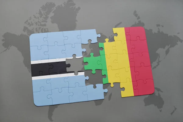 Puzzle with the national flag of botswana and mali on a world map — Stock Photo, Image