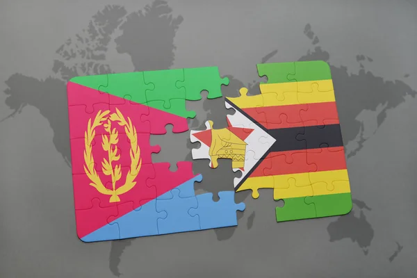 Rompecabezas con la bandera nacional de eritrea y zimbabwe en un mapa del mundo — Foto de Stock