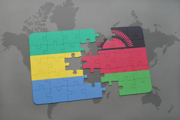 Puzzel met de nationale vlag van gabon en malawi op een wereldkaart — Stockfoto