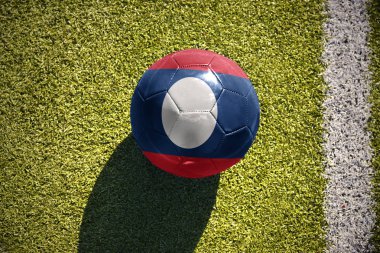 laos bayrağı ile futbol topu sahada yatıyor
