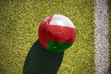 sahada futbol topu Umman bayrağı ile yatıyor