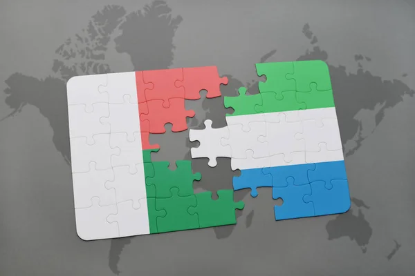 Puzzle con la bandiera nazionale di madagvania e sierra leone su una mappa del mondo — Foto Stock