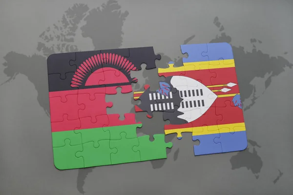 Puzzel met de nationale vlag van malawi en swaziland op een wereldkaart — Stockfoto