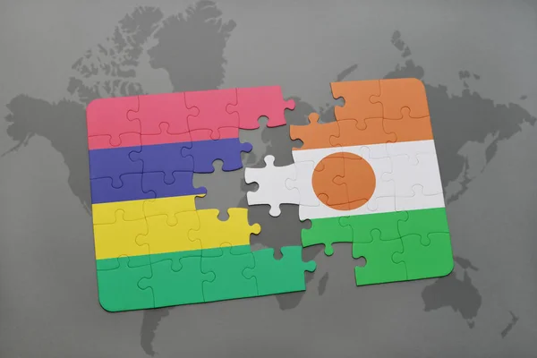Puzzle with the national flag of mauritius and niger on a world map — Stock Photo, Image