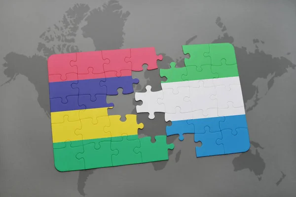 Puzzel met de nationale vlag van mauritius en sierra leone op een wereldkaart — Stockfoto