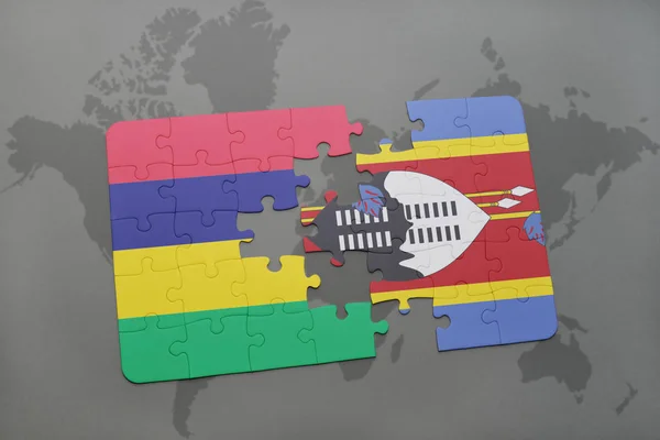 Puzzel met de nationale vlag van mauritius en swaziland op een wereldkaart — Stockfoto