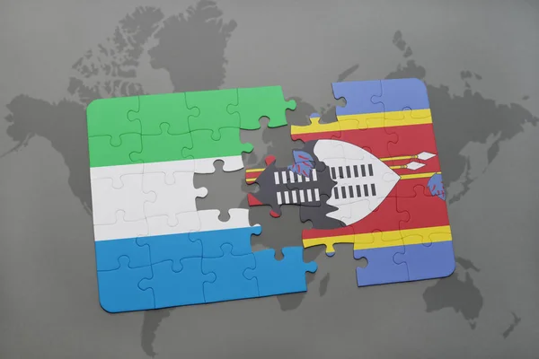 Puzzle avec le drapeau national de la Sierra Leone et du Swaziland sur une carte du monde — Photo