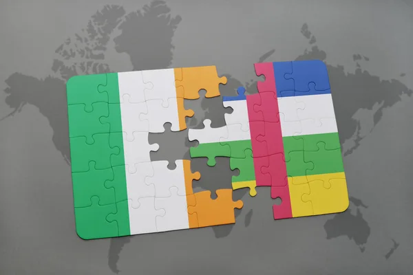 Puzzle with the national flag of ireland and central african republic on a world map — Stock Photo, Image