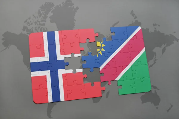 Quebra-cabeça com a bandeira nacional de norway e namibia em um mapa do mundo — Fotografia de Stock