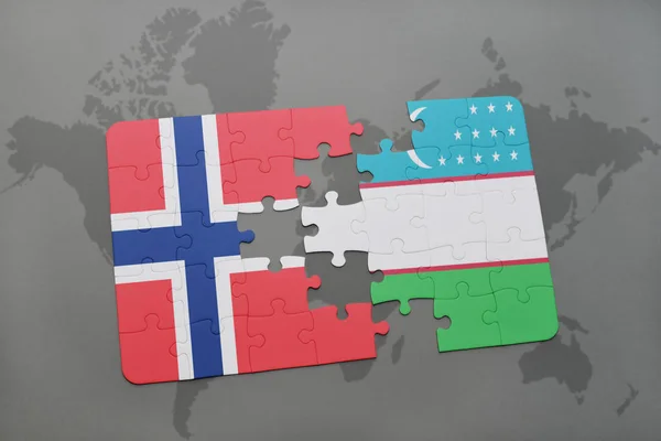 Головоломка з національним прапором Норвегії та Узбекистану на карті світу — стокове фото