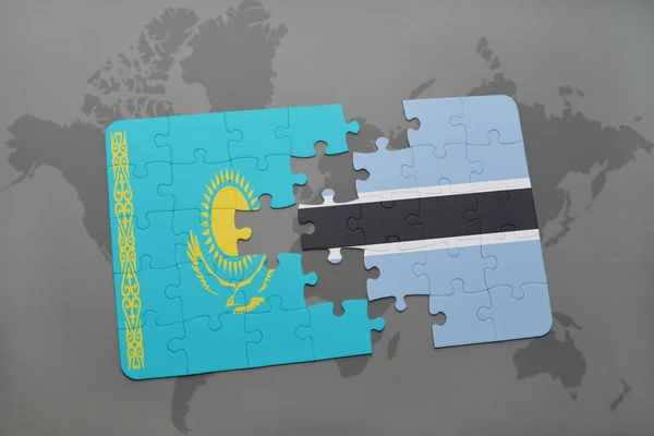 Головоломка с национальным флагом Казахстана и ботсваны на карте мира — стоковое фото