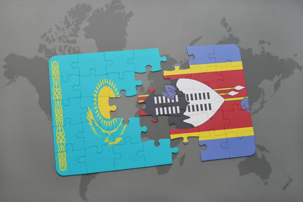 Rompecabezas con la bandera nacional de Kazajstán y Swazilandia en un mapa del mundo — Foto de Stock