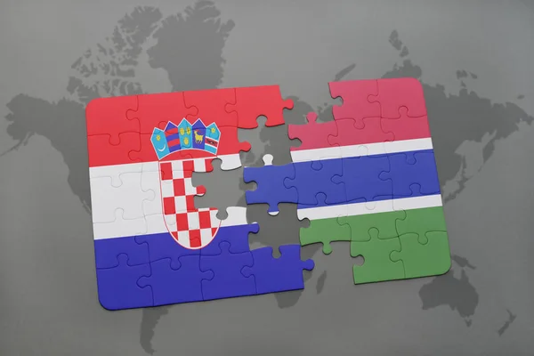 Puzzle avec le drapeau national de la croatie et de la gambie sur une carte du monde — Photo