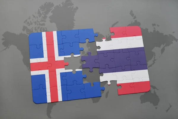 Головоломка з національним прапором Ісландії та Таїланду на карті світу — стокове фото