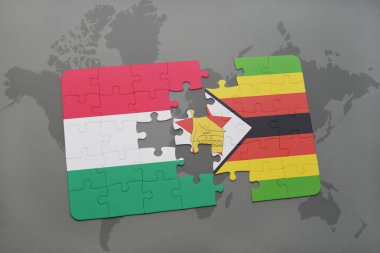 Macaristan ve Zimbabve Ulusal bayrak bir dünya haritası üzerinde ile bulmaca