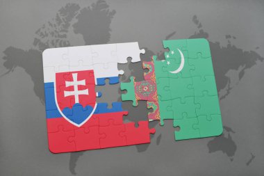 Türkmenistan ve Slovakya ulusal bayrak bir dünya haritası üzerinde ile bulmaca